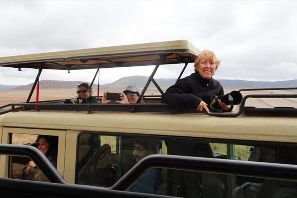 peeking out of safari jeep in Tanzania